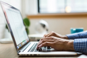 Man typing on computer